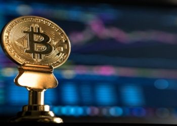 Bitcoin Commemorative Coin with a laptop screen back drop