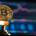 Bitcoin Commemorative Coin with a laptop screen back drop