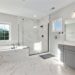 What are the benefits of using toughened glass for shower screens?