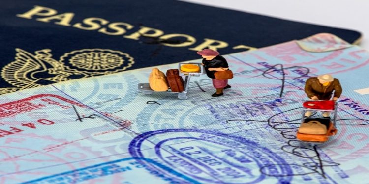 Passport Visa and little traveler Figurines