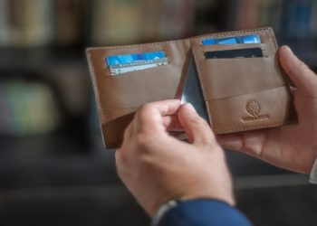 Man holding a minimalist card wallet