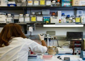 Woman working inside a laboratory