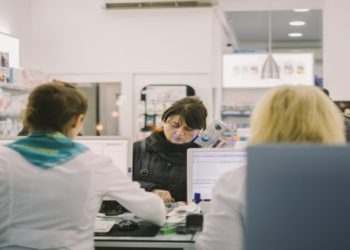 Customer and pharmacist at a pharmacy