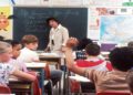 Classroom filled with students and a teacher