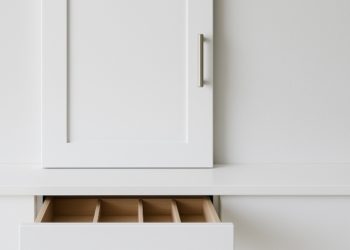 Efficient kitchen storage solutions with custom drawers and classic cabinet styles