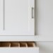 Efficient kitchen storage solutions with custom drawers and classic cabinet styles