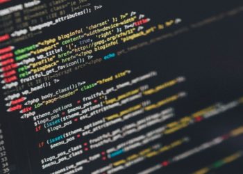 Close-up of a laptop screen displaying lines of code in a text editor, highlighting programming work in progress.