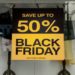 Black Friday sale sign displayed in a store window, featuring bold text and eye-catching colors to attract shoppers.