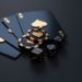 Poker chips and dice scattered on a smooth black surface, creating a striking contrast.