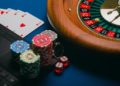 Collection of online casino games displayed alongside colorful gambling chips.