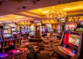 Vibrant casino interior with rows of colorful slot machines, plush carpeting, and chandelier lighting, creating an energetic and inviting atmosphere.