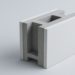 White, rectangular concrete block with a hollow center rests on a light gray surface. The modern design conveys simplicity and functionality.