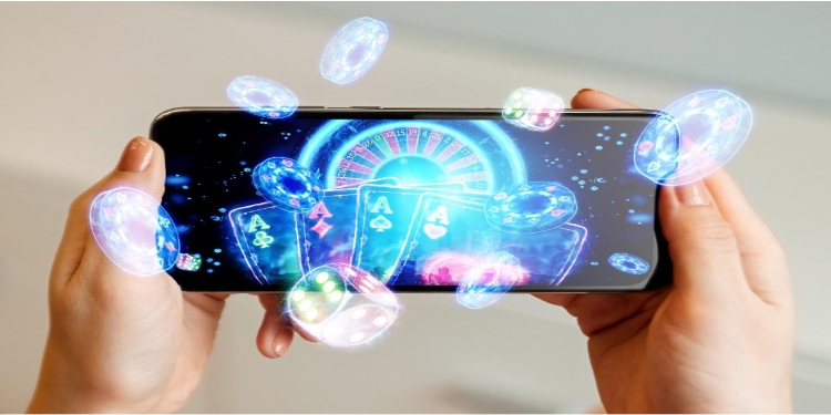 Hands holding a smartphone displaying a vibrant casino game with glowing poker chips, cards, and a roulette wheel, conveying excitement and entertainment.