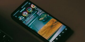 Smartphone showing the Instagram app on a desk