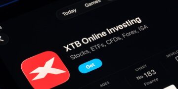 XTB Online Investing app on the App Store shown on a tablet screen