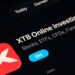 XTB Online Investing app on the App Store shown on a tablet screen